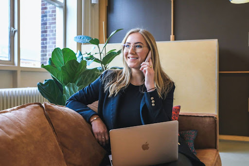 Woman on the phone and a laptop